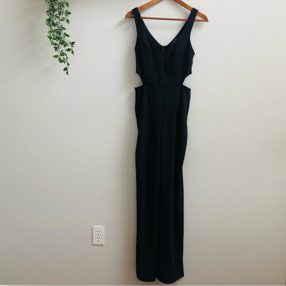 Crystal Sky Black Jumpsuit with a V-neck and Cutouts On The Sides of the Waist